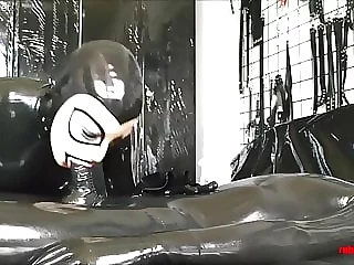Mistress in black latex gets worshiped and fucked by slave
