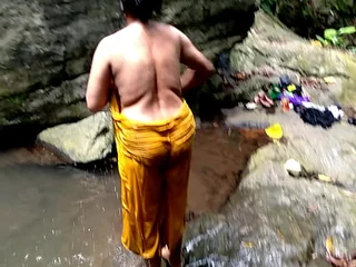 Ashok and Surwana Kumari take turns pissing in public while ablution in a pond well-intentioned